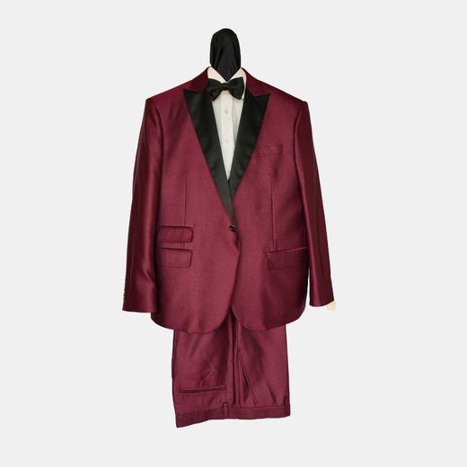 Burgundy tuxedo suit with black satin peak lapels, on a dress form